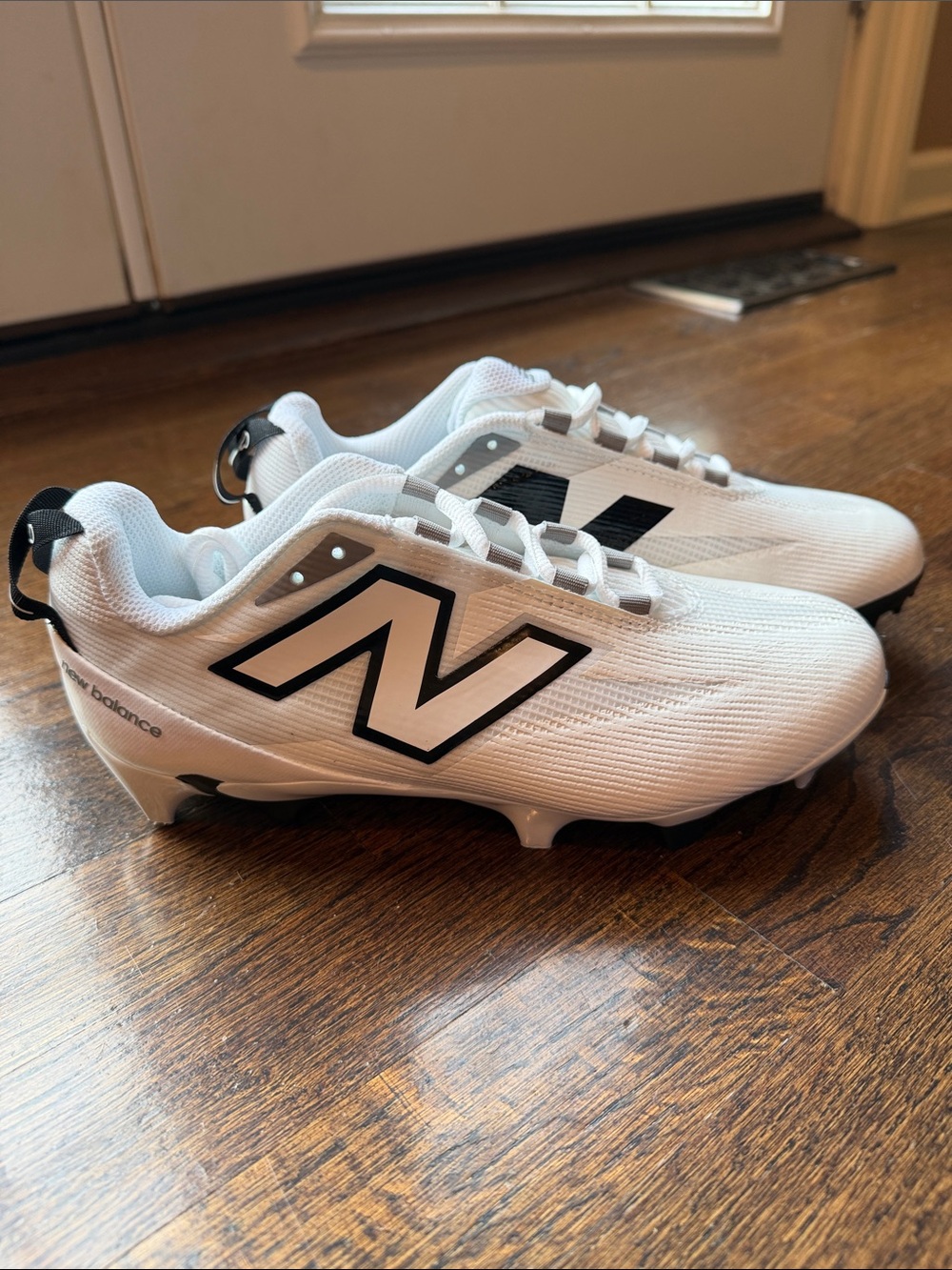 New Balance Burn X5 White and Black Lacrosse Cleats